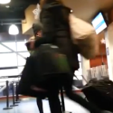 a blurry image of people walking in a building