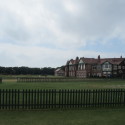 a large building with a fence in front of it