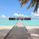 a wooden walkway leading to a beach