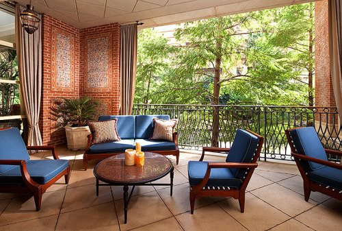 a patio with blue furniture