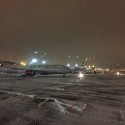 airplanes on a snowy runway