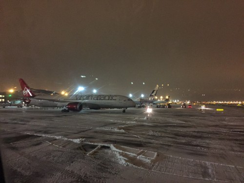 airplanes on a snowy runway
