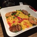 a bowl of rice with shrimp and sausage