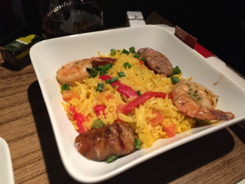 a bowl of rice with shrimp and sausage