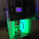 a coffee machine with a green light