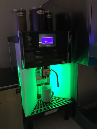 a coffee machine with a green light