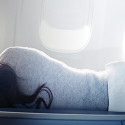 a woman lying on a plane