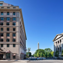 a street with buildings and a monument