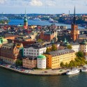 a city with many buildings and boats on the water