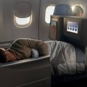 a man sleeping in an airplane