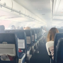 a group of people sitting in an airplane
