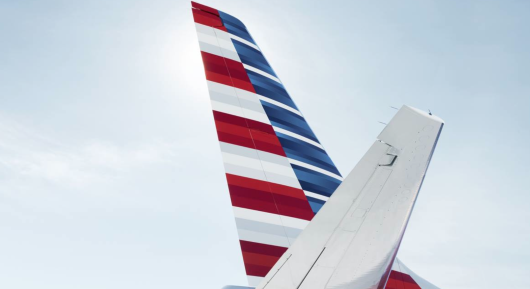 the tail of an airplane with a red white and blue stripe