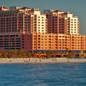 a large building with many windows and a body of water