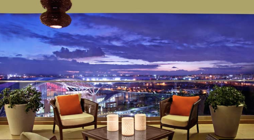 a balcony with a view of a city