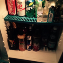 a shelf of drinks and beverages