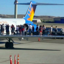 a group of people standing on an airplane