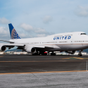 a large white airplane on a runway