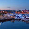 a marina with many boats and buildings