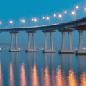 a bridge over water with lights