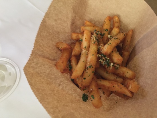 a french fries in a brown paper bag