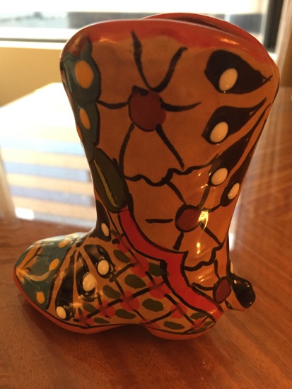 a ceramic boot on a table
