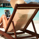 a woman sitting in a chair with a laptop