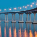 a bridge over water with lights