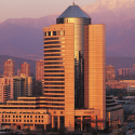 a tall building with a mountain in the background