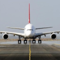 a white airplane on a runway