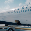 a plane being towed by a trailer