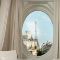 a window with a view of the eiffel tower