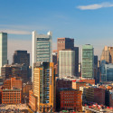 a city skyline with many tall buildings