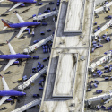 an aerial view of airplanes at an airport
