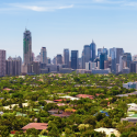 a city with many buildings and trees