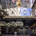 a hotel entrance with flags