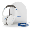 a pair of white headphones next to a white bag