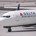 a white airplane on the tarmac