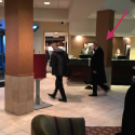 a group of people in a hotel lobby