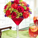 a bouquet of flowers in a martini glass