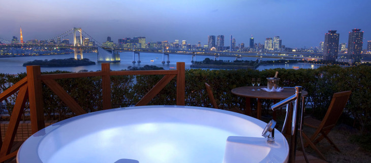a hot tub overlooking a city