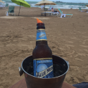 a beer bottle in a bucket on a beach