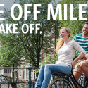 a man and woman sitting on a bicycle