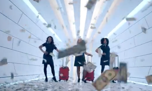 a group of women with luggage in a hallway