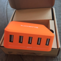 an orange usb hub in a box