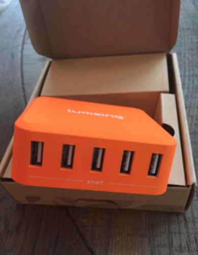 an orange usb hub in a box