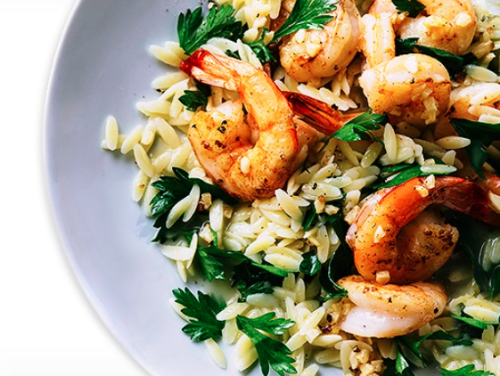 a plate of food with shrimp and rice