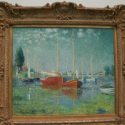 a painting of boats in a frame