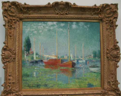 a painting of boats in a frame