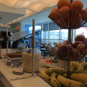 a buffet table with fruit and snacks