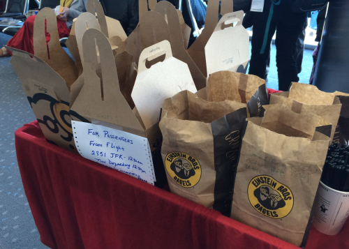 a group of brown paper bags with white labels